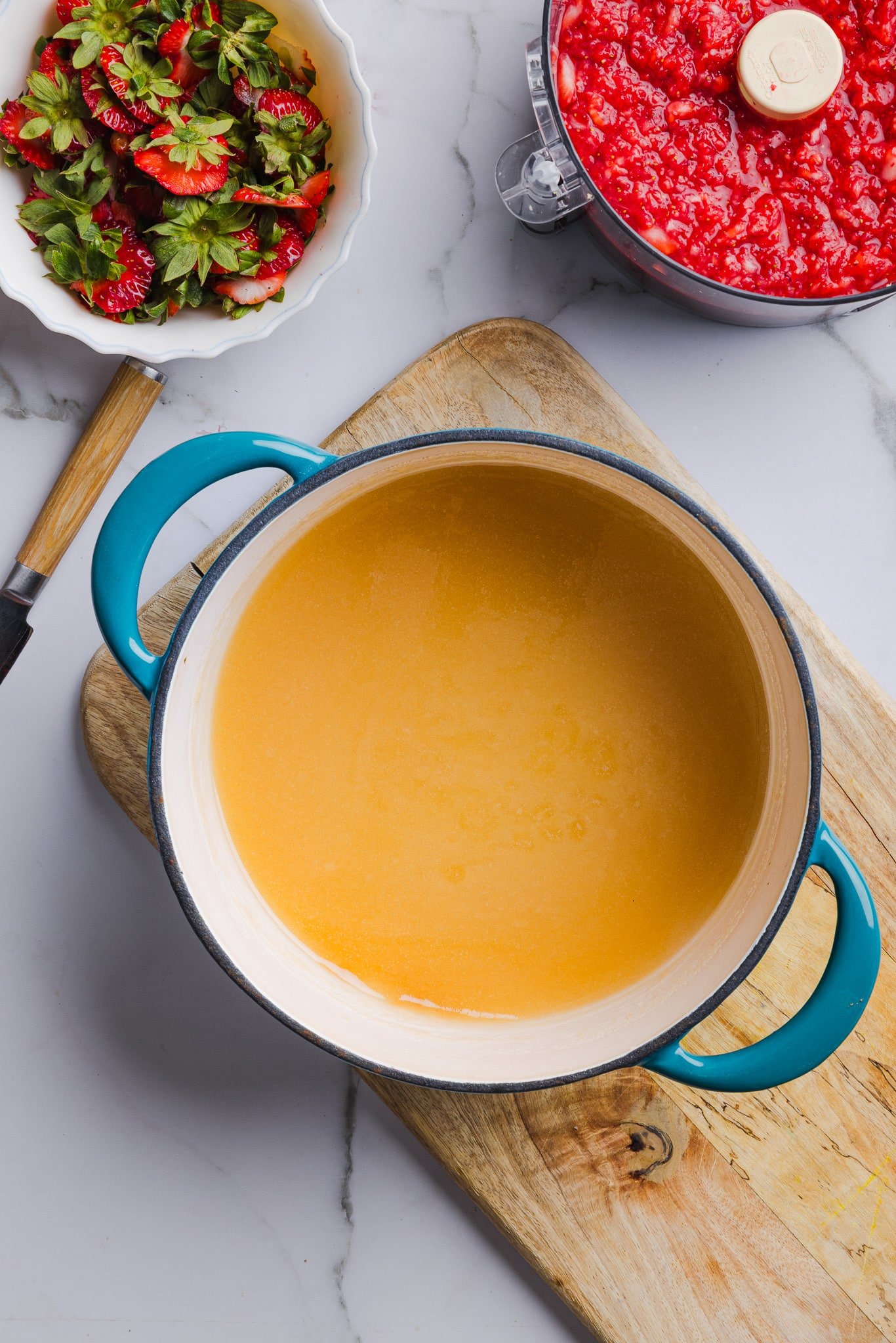 Low sugar pectin and sugar mixed together in a saucepan.