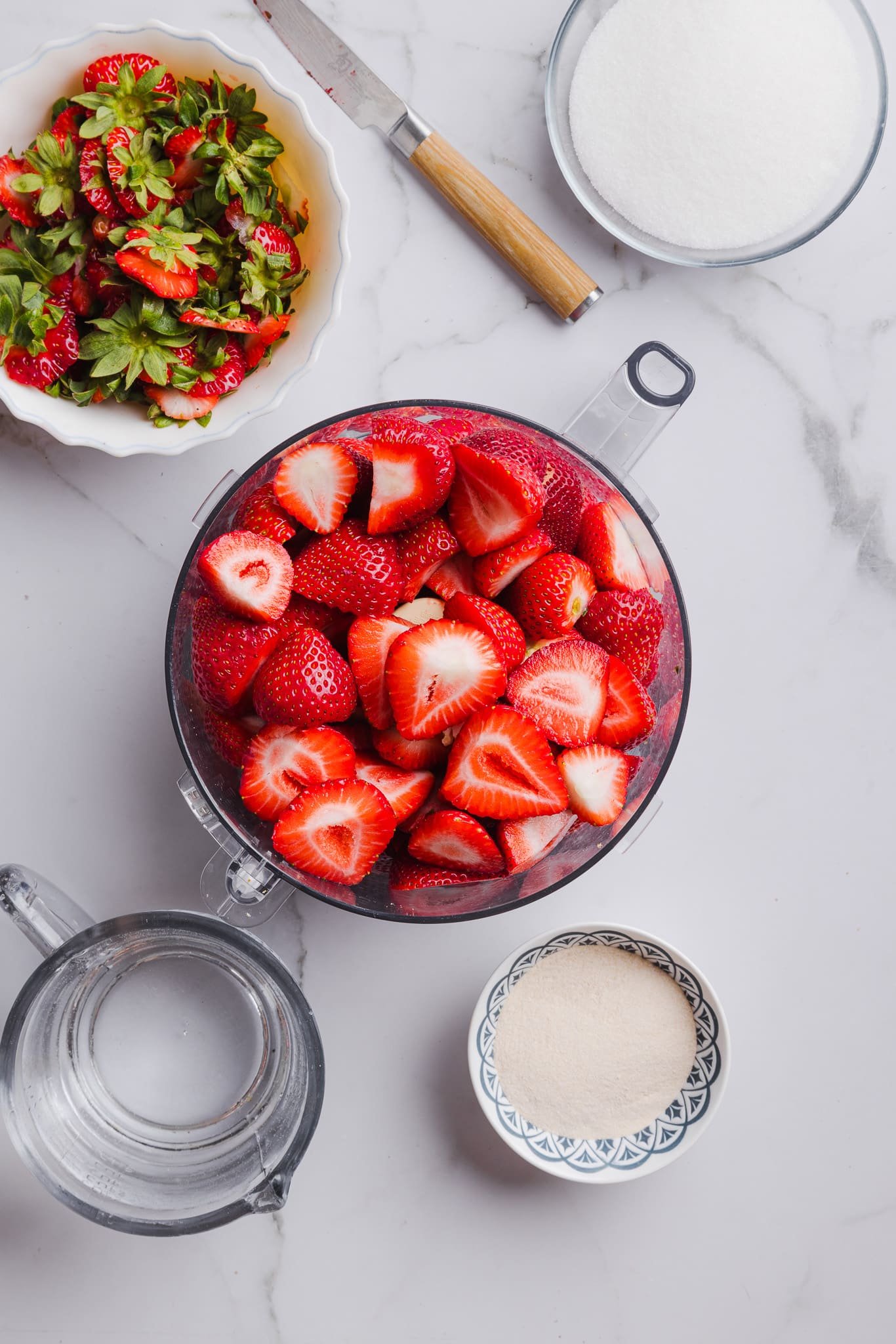 Fresh strawberries in a food processor.