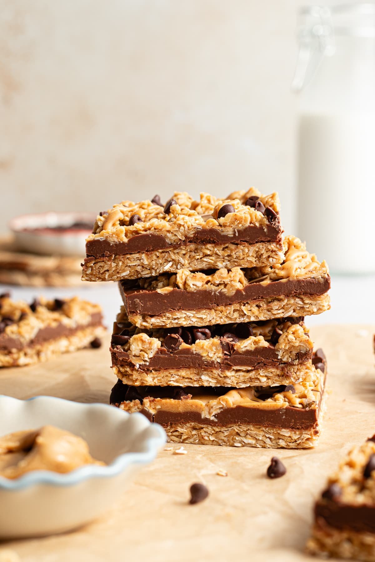 No bake chocolate oat bars stacked on top of one another.