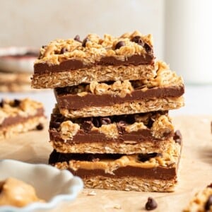No bake chocolate oat bars stacked on top of one another.