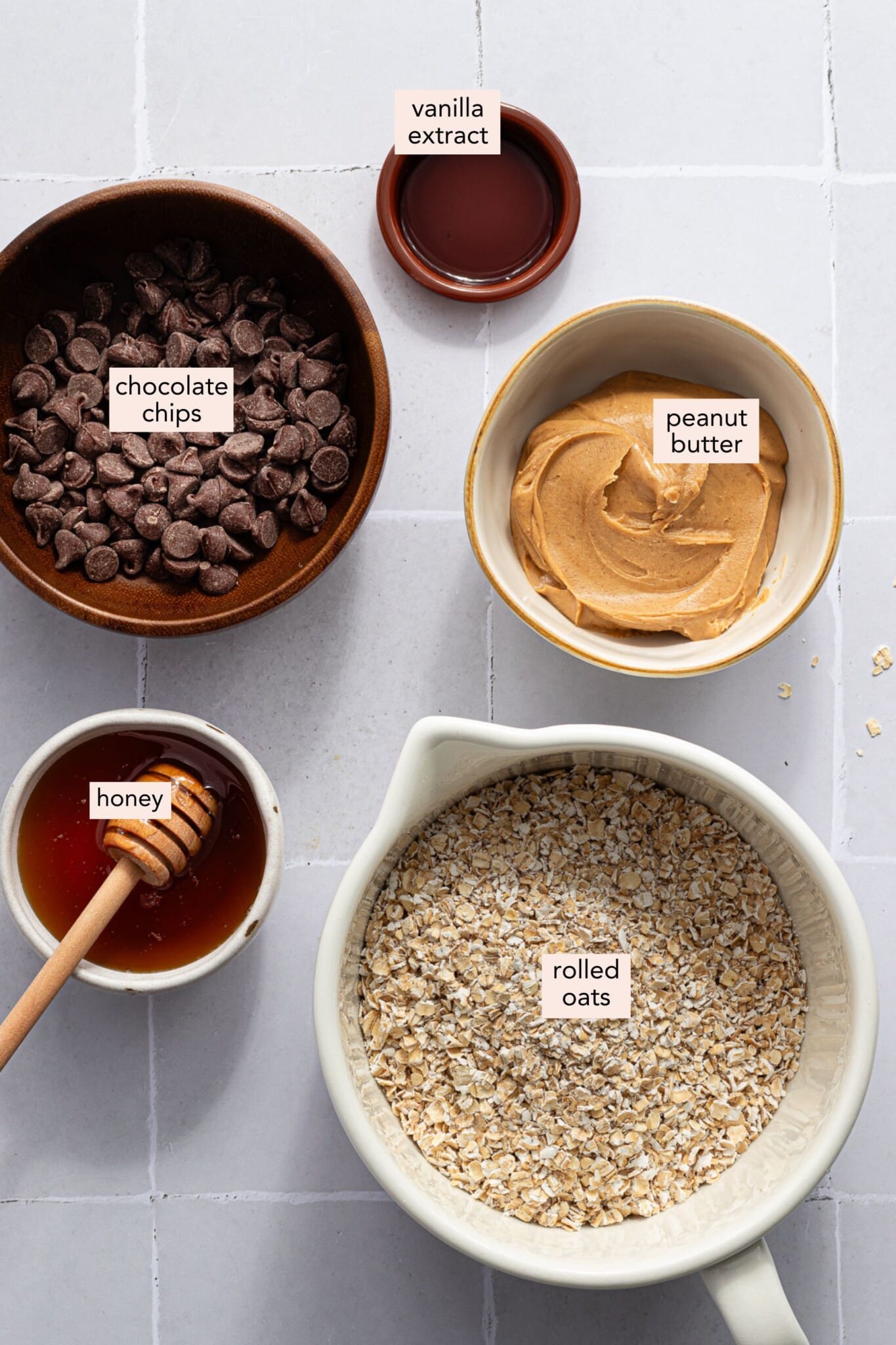 Ingredients for no bake chocolate oat bars on a countertop with labels.