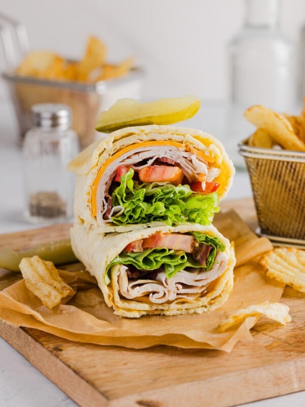A cottage cheese wrap filled with turkey, cheese, bacon, lettuce and tomato.