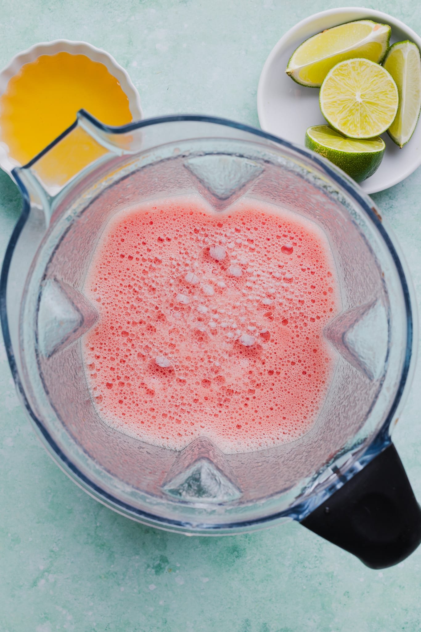 Blended watermelon, lime, and honey in a blender.