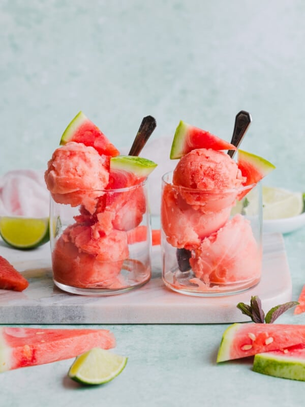 Watermelon sorbet served in 2 glass cups.