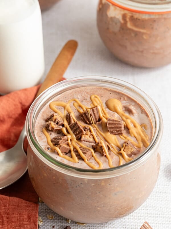 Chocolate peanut butter overnight oats topped with mini Reese's and a drizzle of peanut butter.