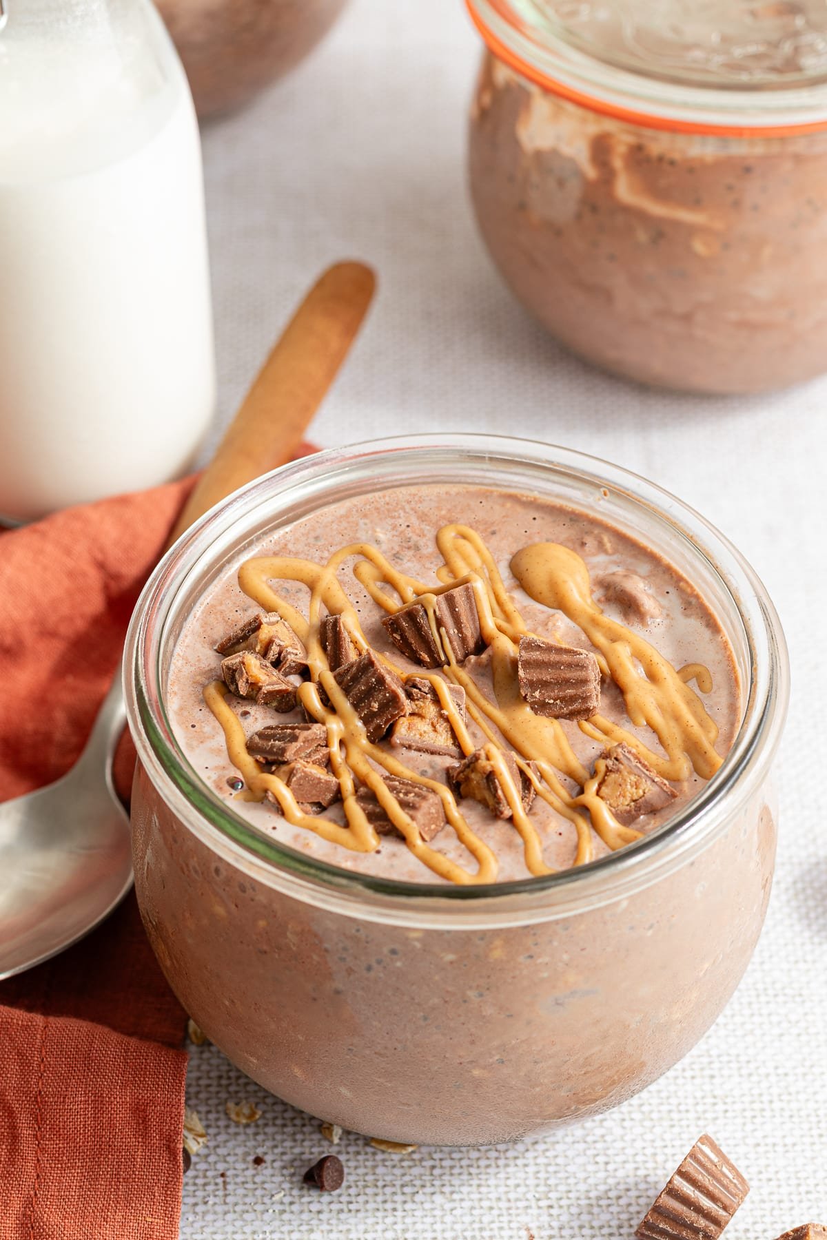 Chocolate peanut butter overnight oats topped with mini Reese's and a drizzle of peanut butter.