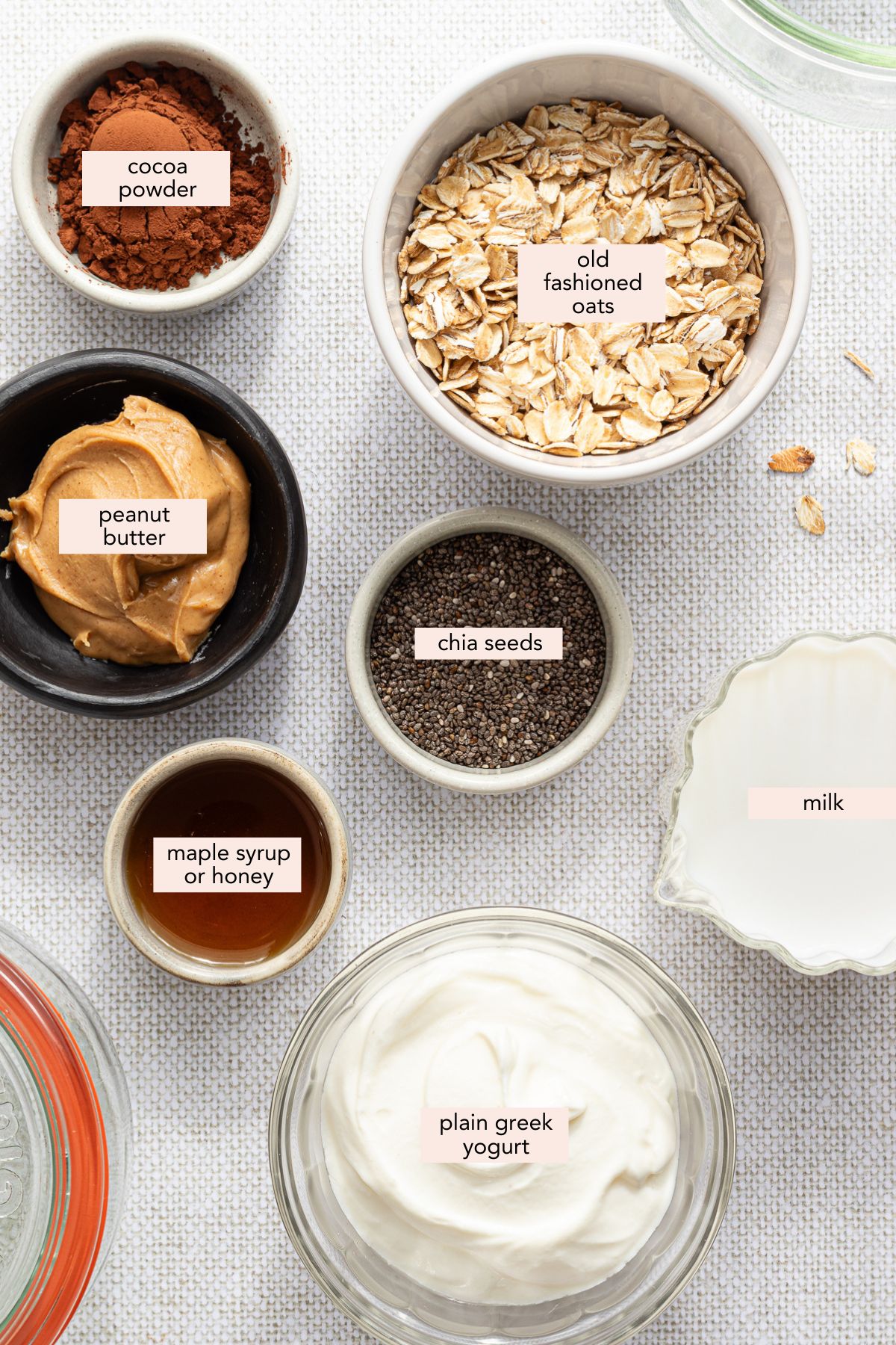 Labeled ingredients for chocolate peanut butter overnight oats.