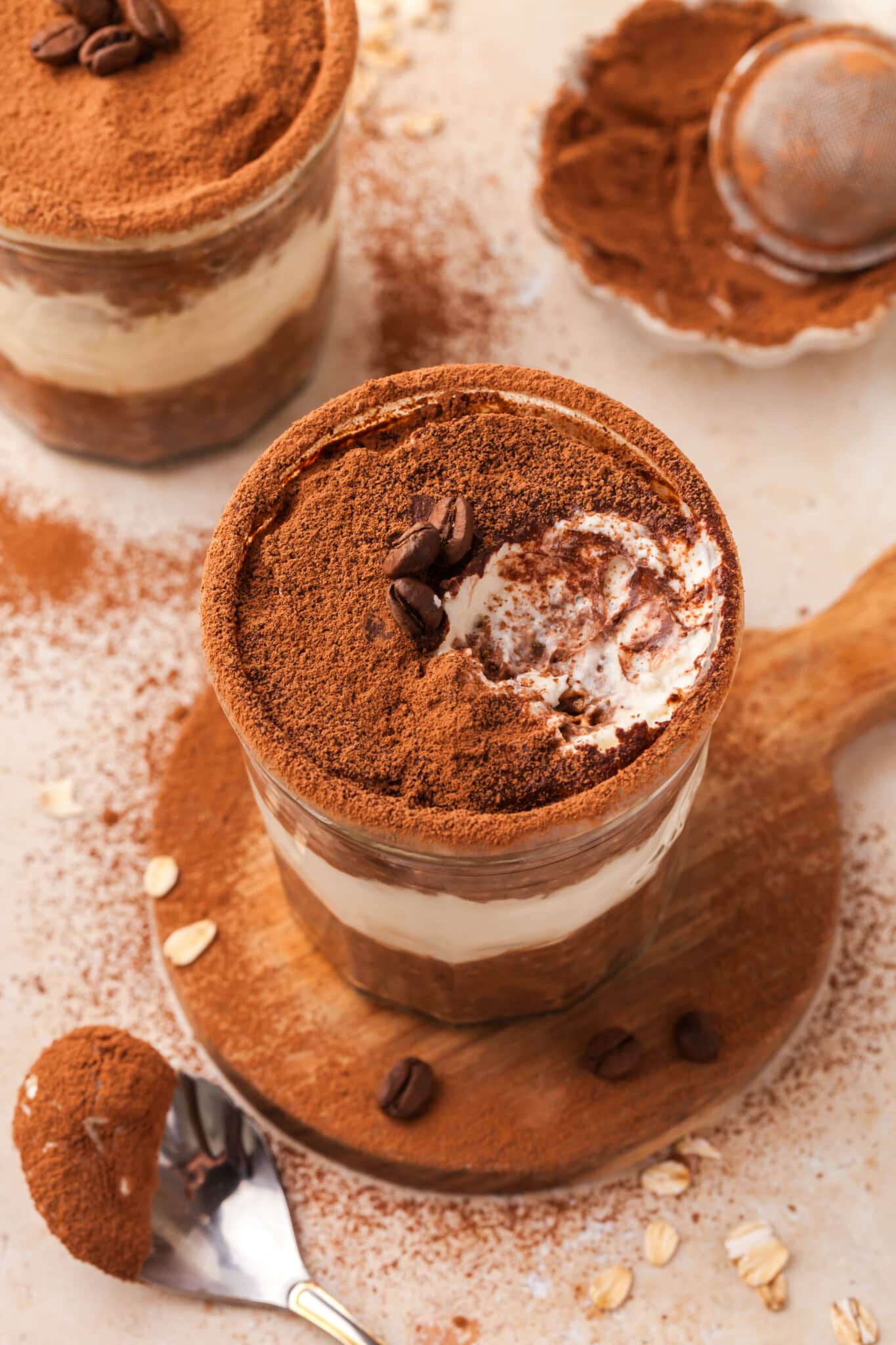 A jar of tiramisu overnight oats with a bite taken out of it.