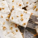 Carrot cake baked oats in a pan with slices.