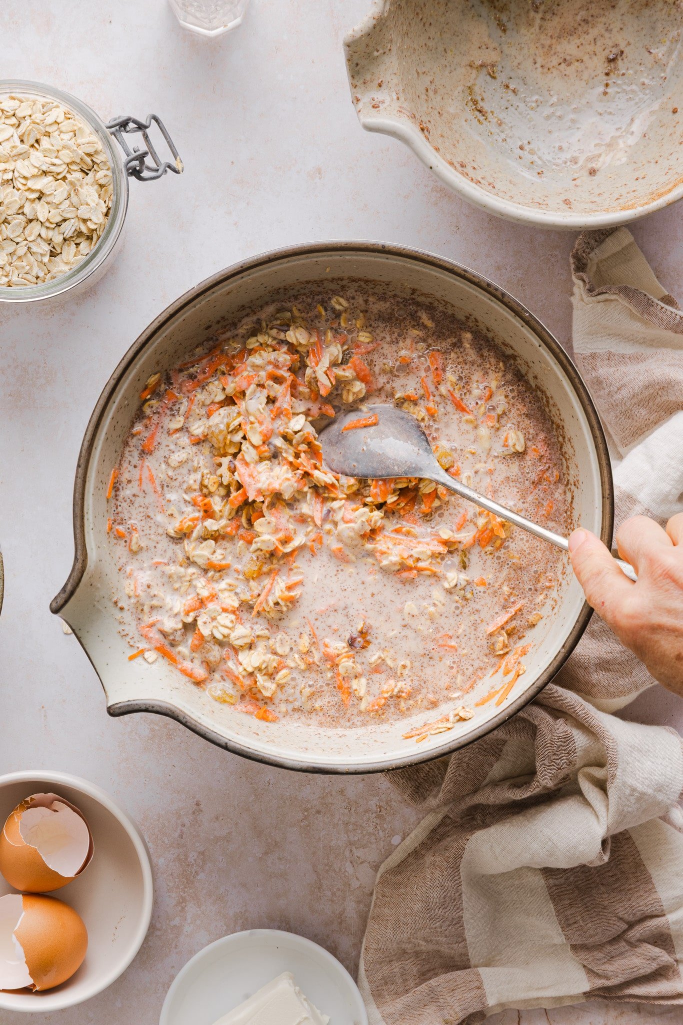 Milk and Greek Yogurt mixed into carrot cake baked oats ingredients.