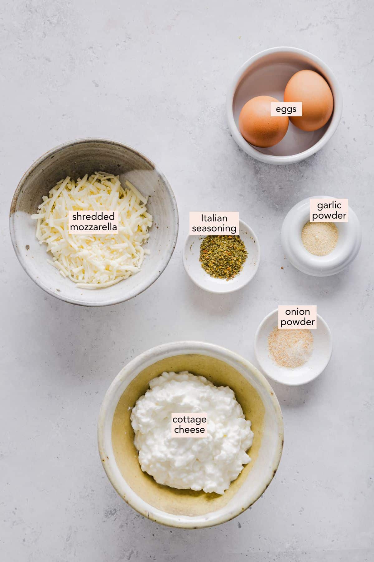 Ingredients for cottage cheese wraps on a countertop with labels.