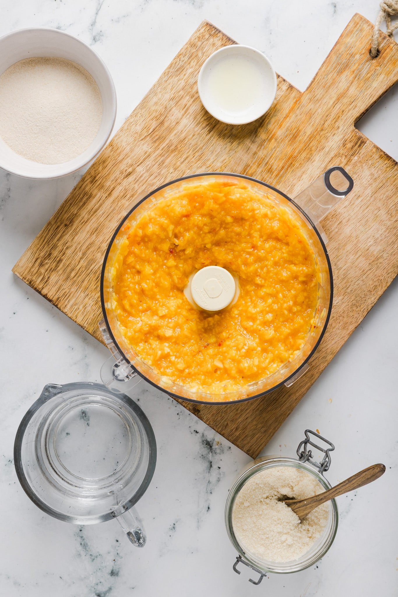 Fresh peach slices blended in a food processor.