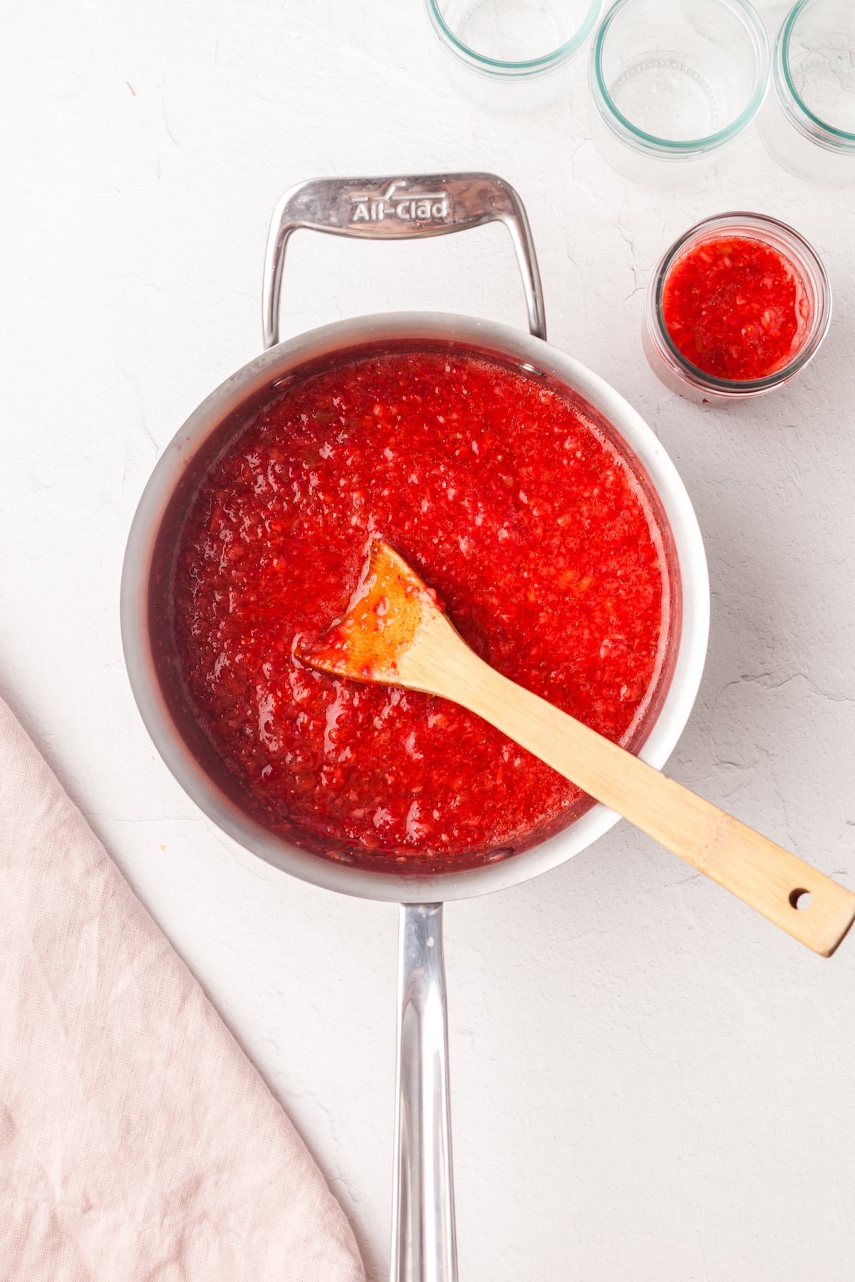 Strawberry rhubarb jam mixed together in a pot.