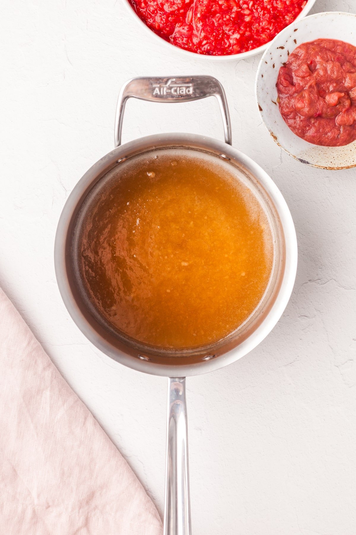 Low sugar pectin, sugar and water being boiled in a small pot.