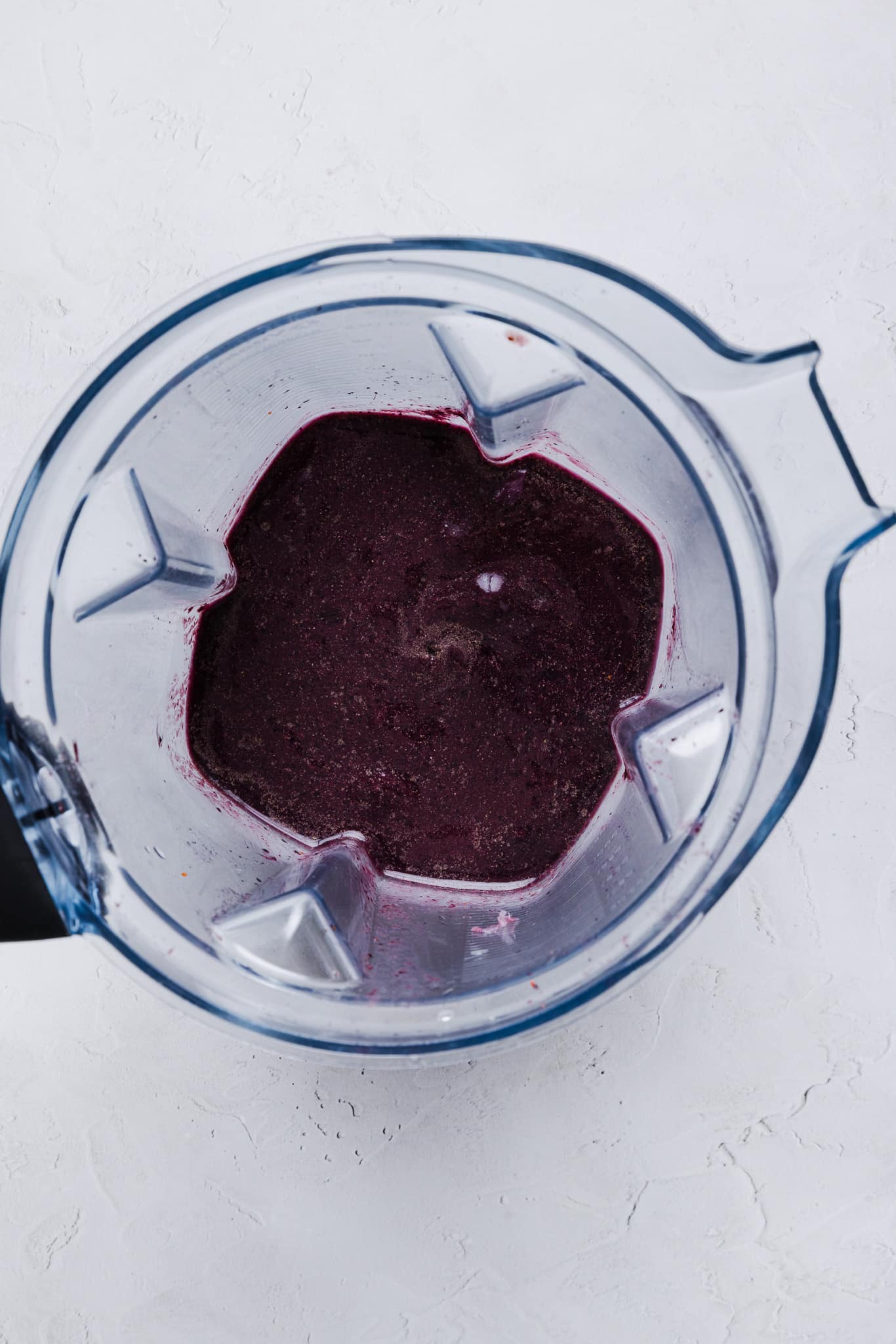 Blended acai, blueberries, banana slices, and coconut water. 