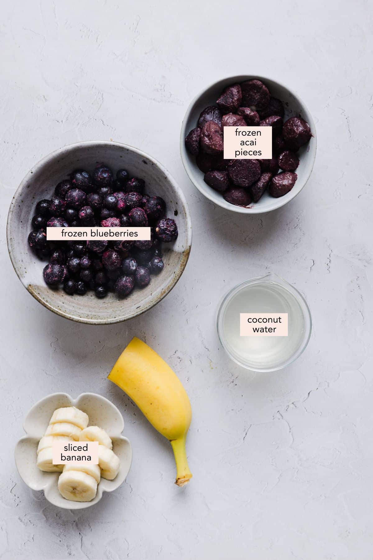 Labeled ingredients to make an acai bowl at home.