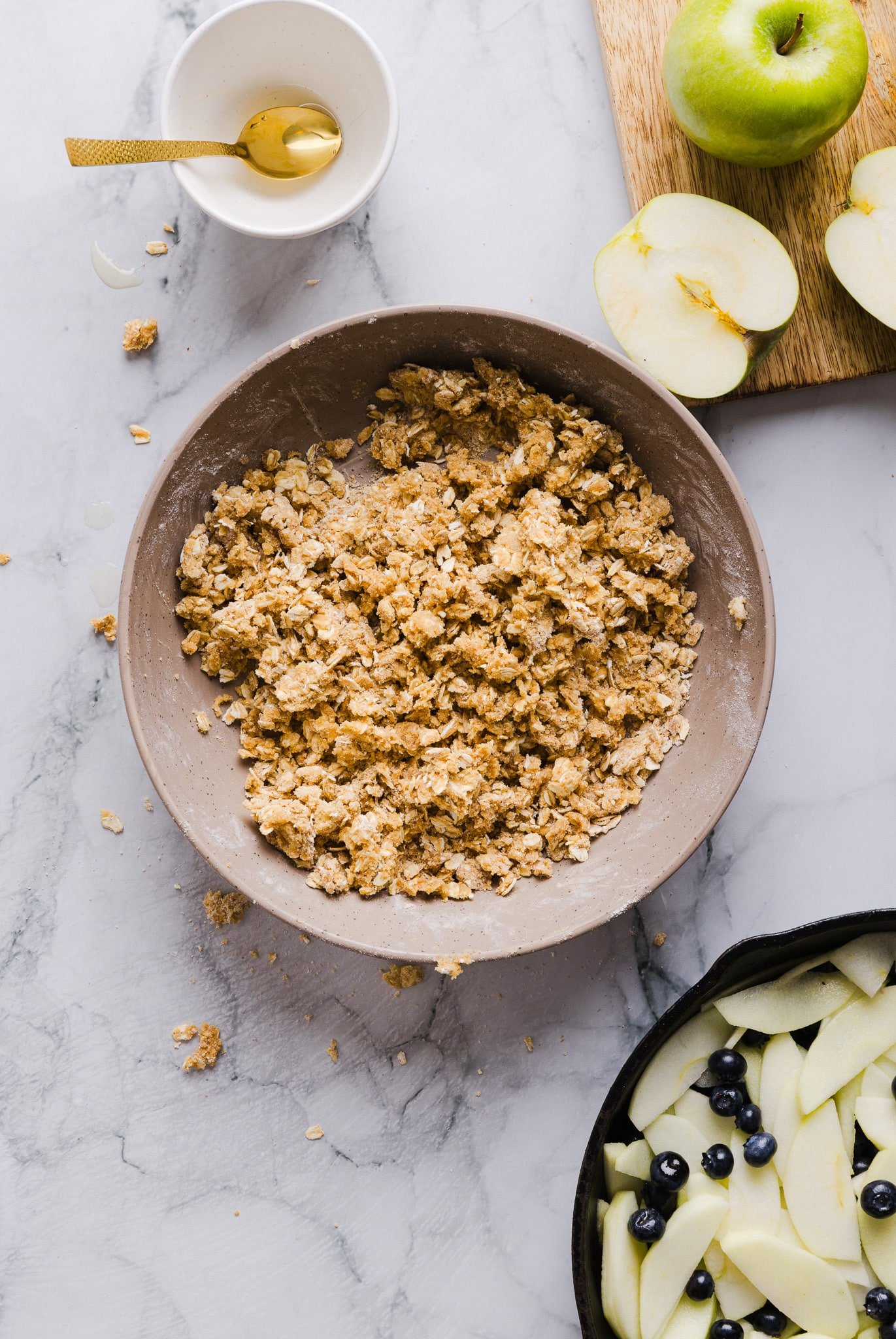 A crumble topping made of butter, flour, oats, brown sugar, salt, and cinnamon.
