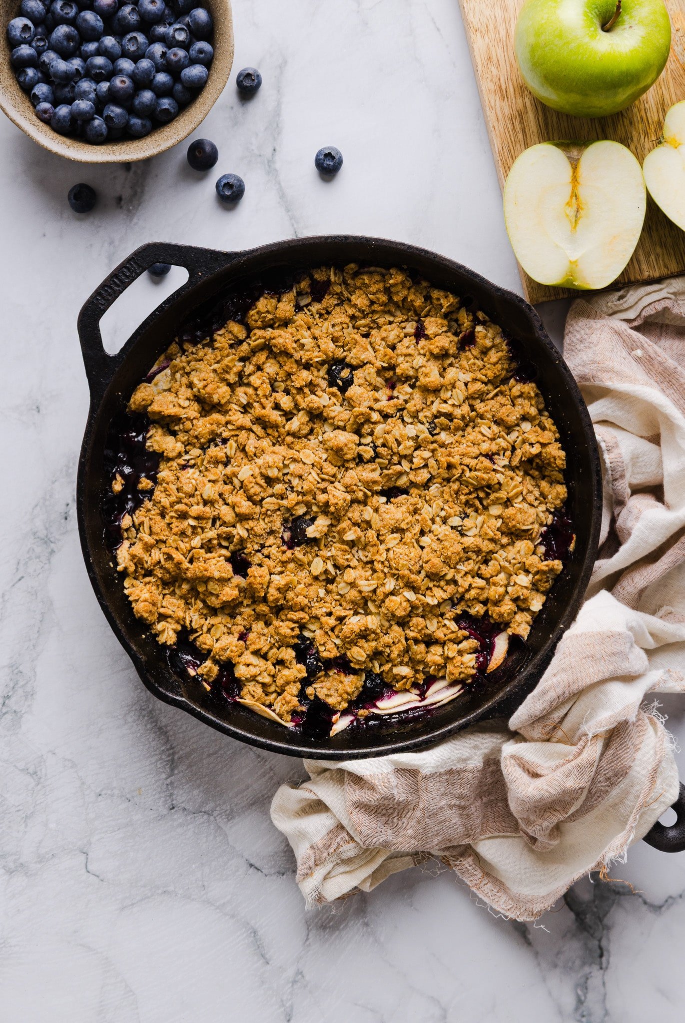 Apple blueberry crumble in a skillet.
