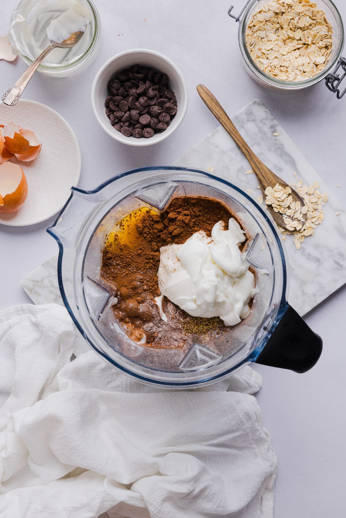 Ingredients for chocolate baked oats in a blender. 