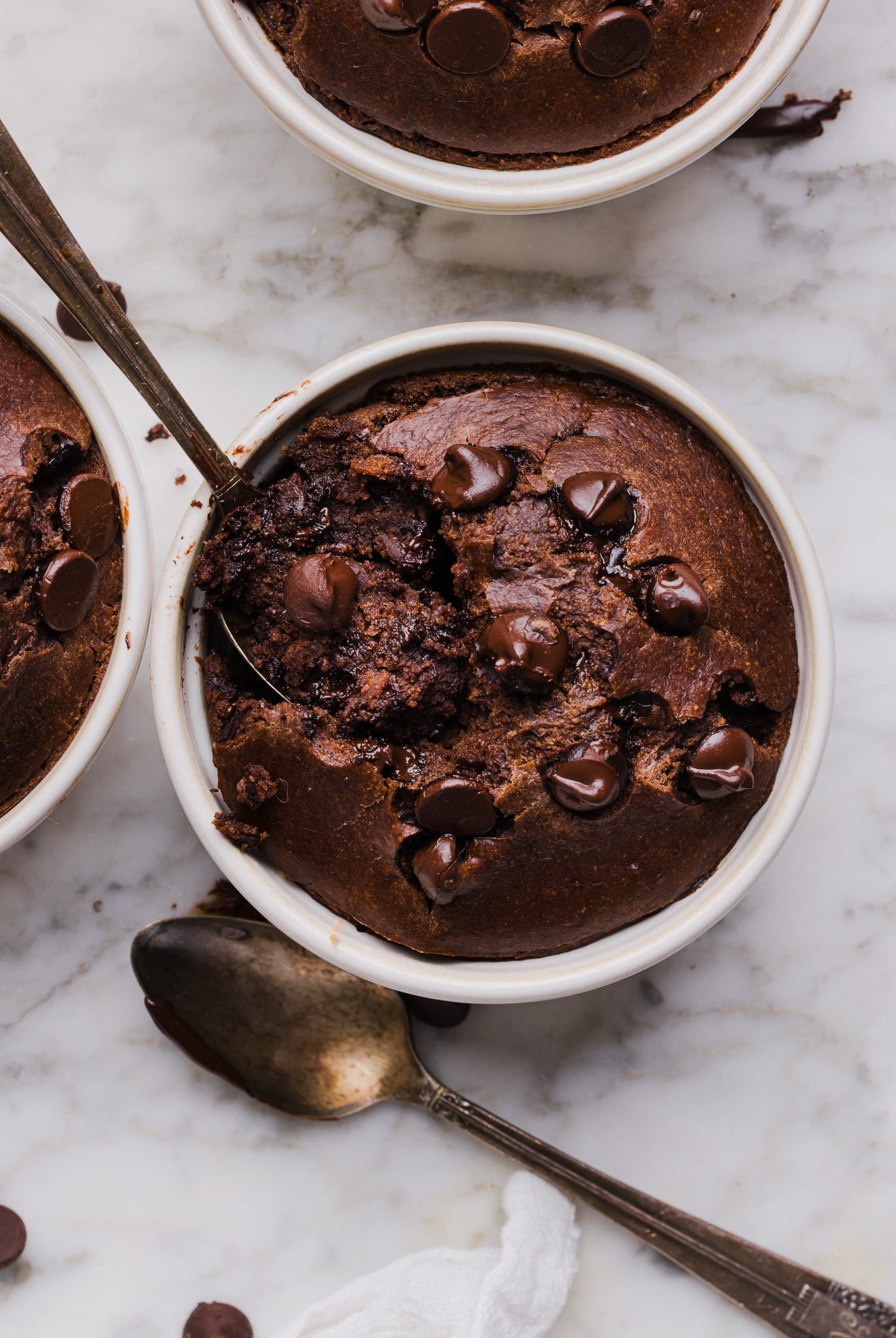 Chocolate baked oats in a white ramekin.