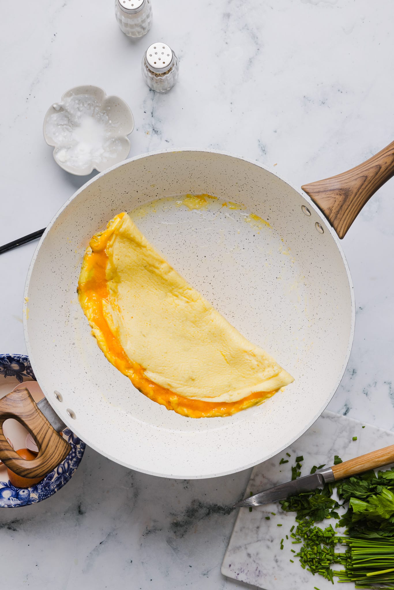 A cottage cheese omelette in a skillet.