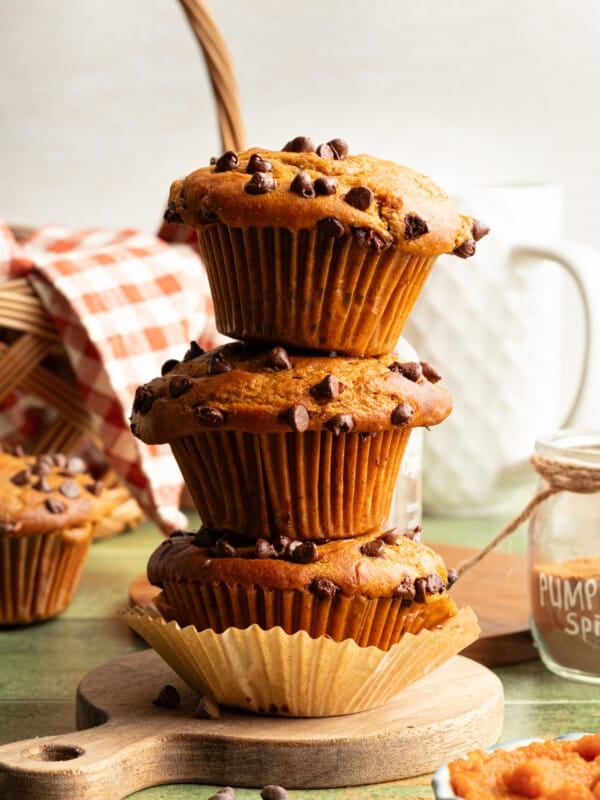 Cottage cheese pumpkin muffins stacked on top of one another.