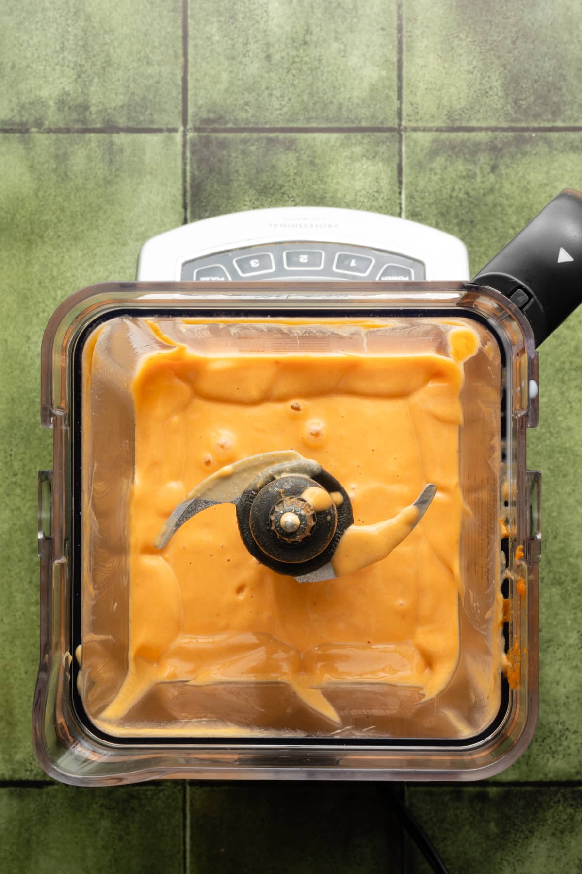 Wet ingredients for cottage cheese pumpkin muffins blended in a blender.