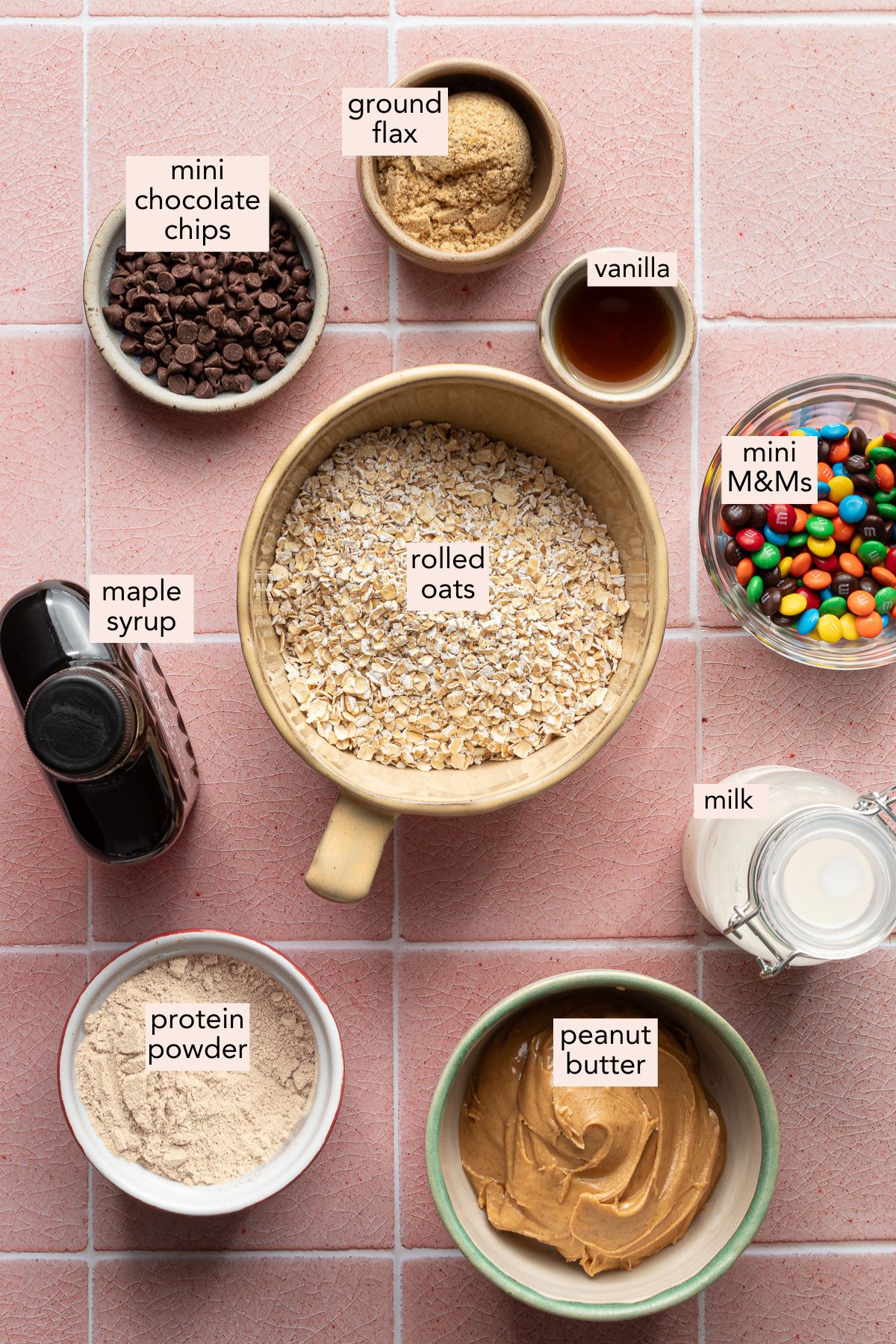 Ingredients for monster protein balls on a countertop with labels.