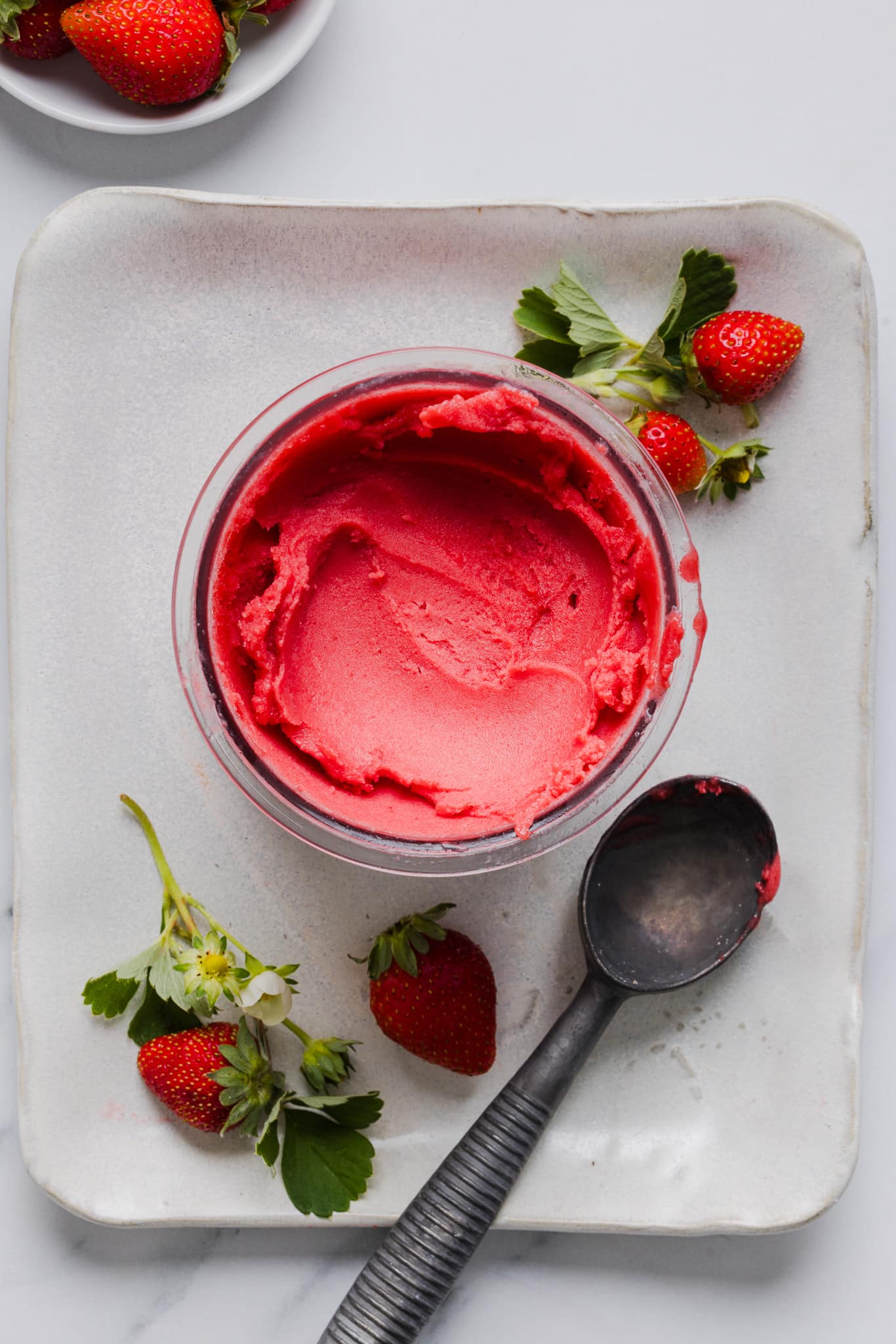 Ninja Creami strawberry sorbet in a pint container.