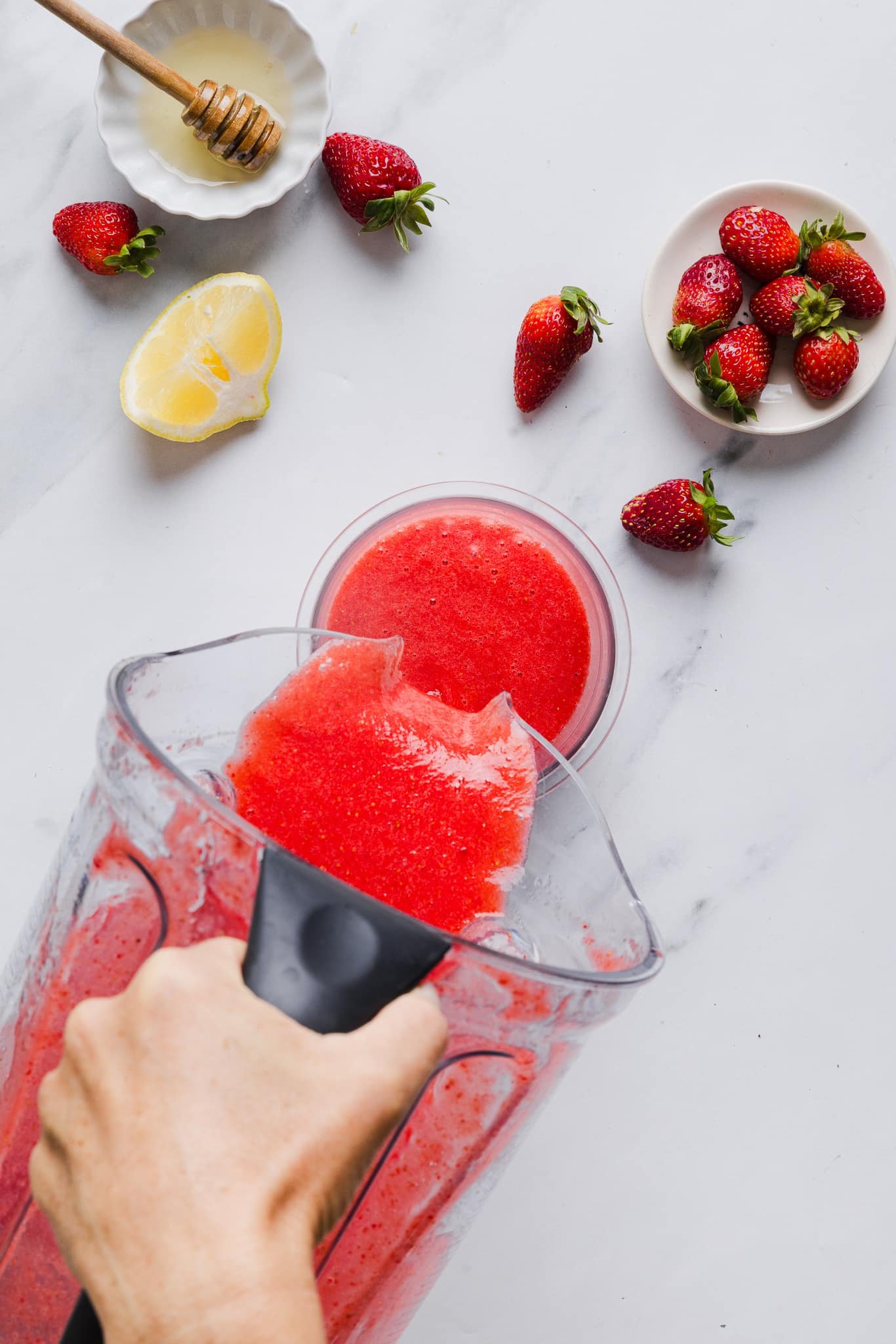 Pour blended strawberry mixture into pint container.