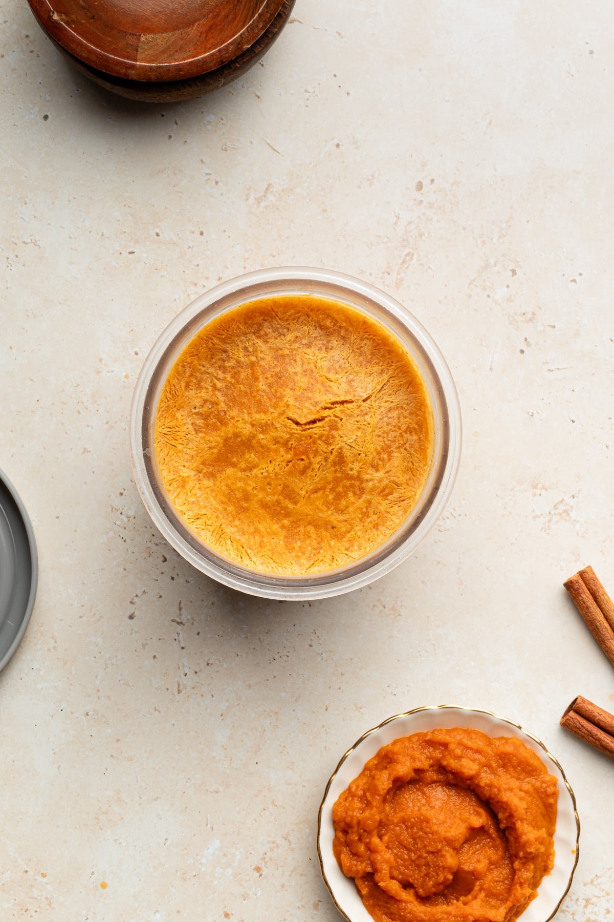Ninja creami pumpkin ice cream ingredients frozen in a pint container.