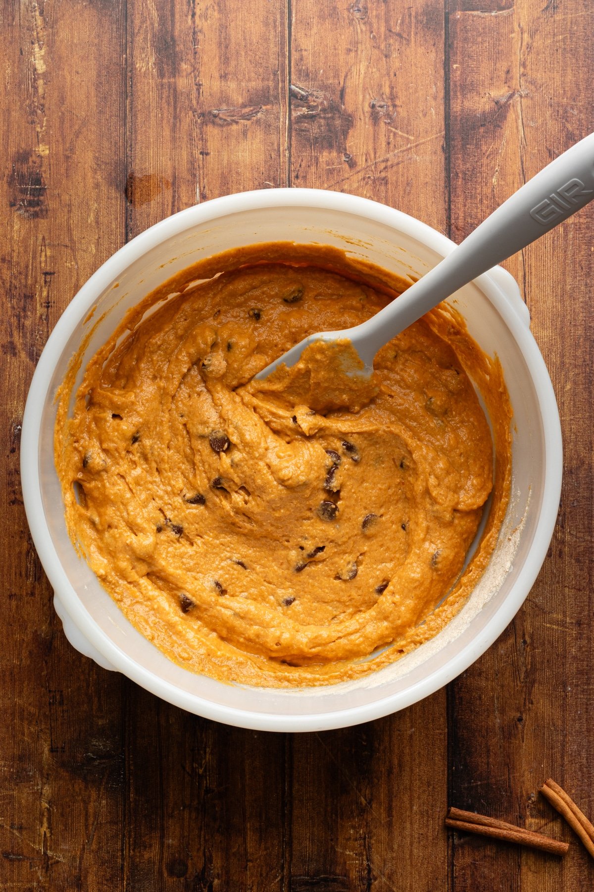 Pumpkin protein bread batter in a white large bowl.