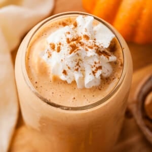 Pumpkin protein smoothie topped with whipped cream.
