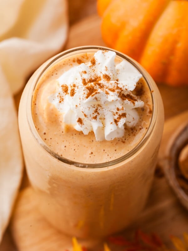 Pumpkin protein smoothie topped with whipped cream.
