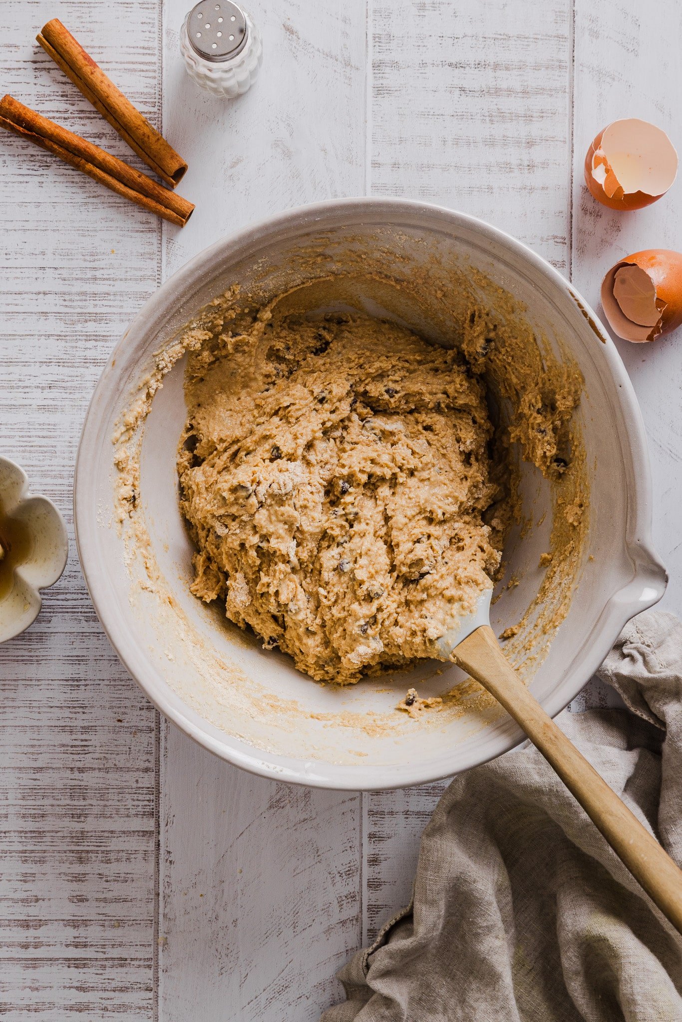 Banana cottage cheese muffin batter being stirred with a rubber spatula.