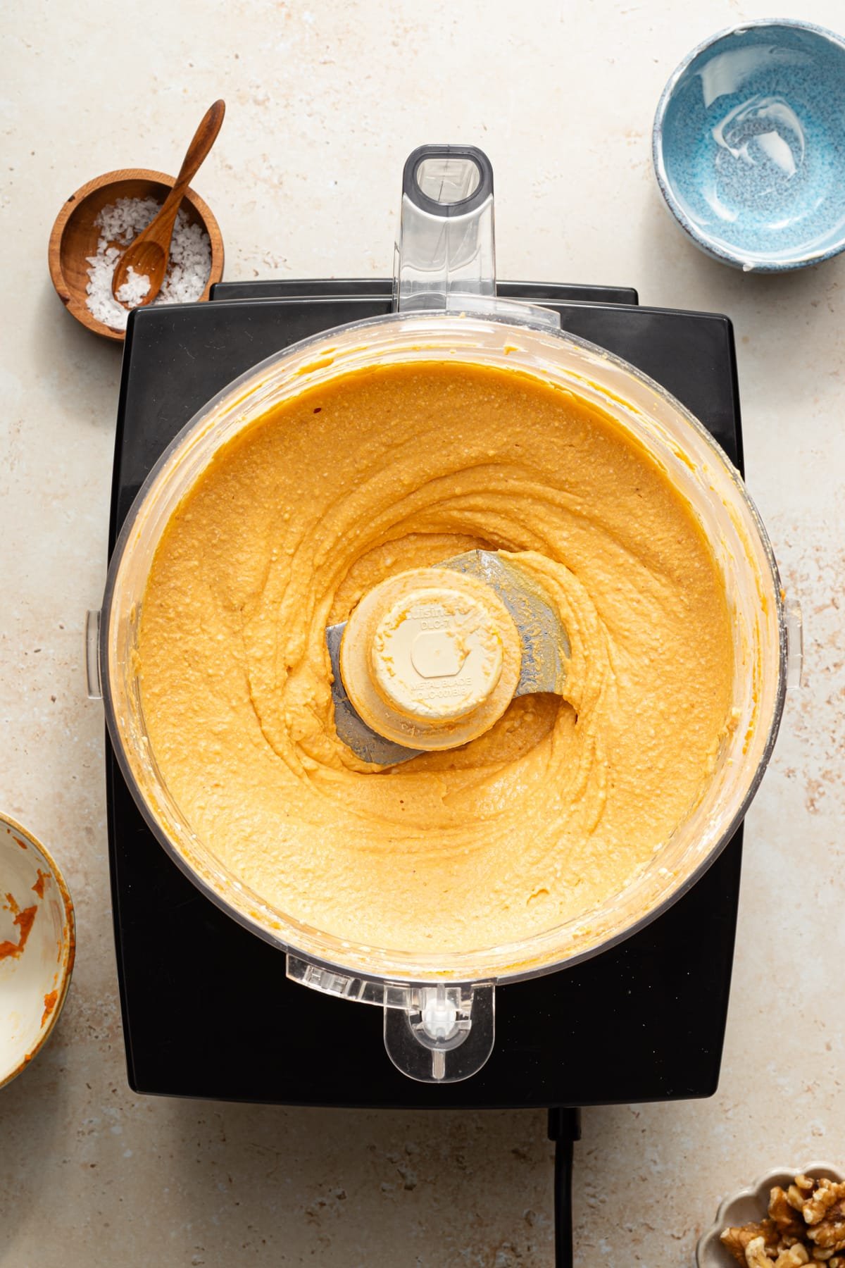 Pumpkin feta dip ingredients blended smooth in a food processor.