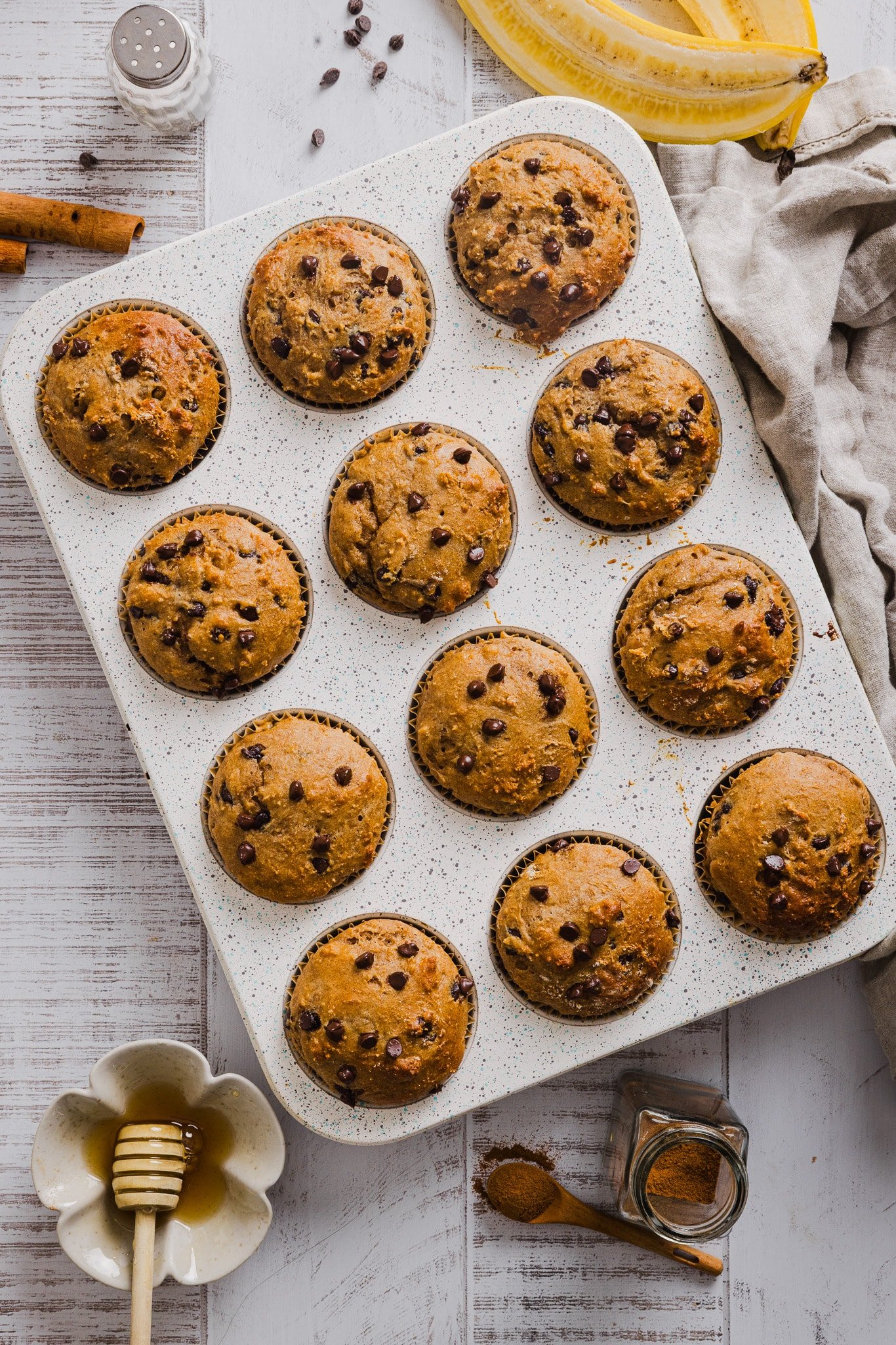 Baked banana cottage cheese muffins in a muffin pan.