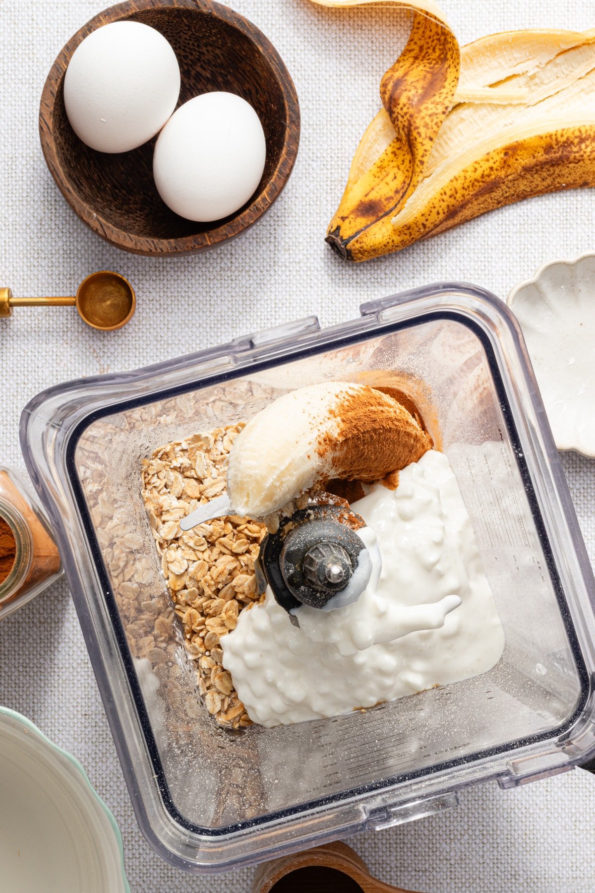 Ingredients for banana cottage cheese pancakes in a blender.