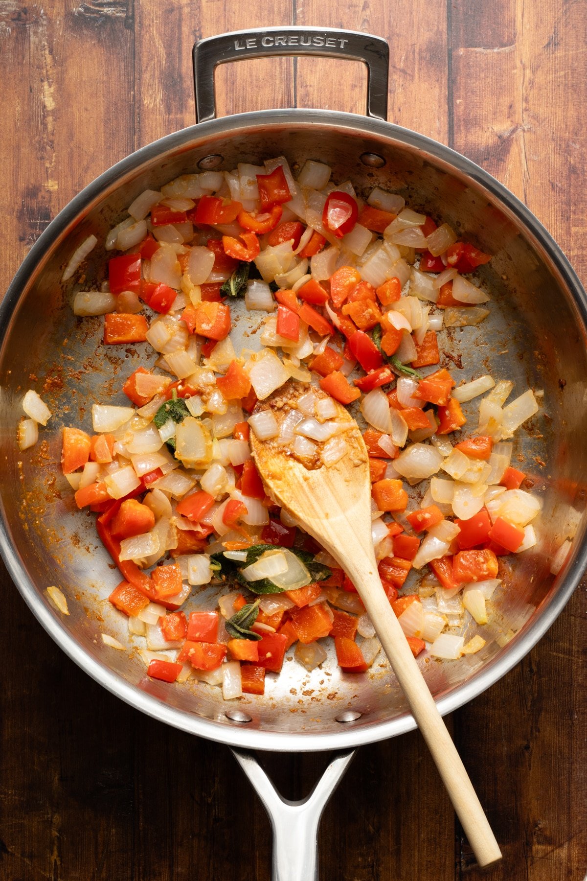 Veggies blended in a sauté pan for pumpkin pasta sauce.