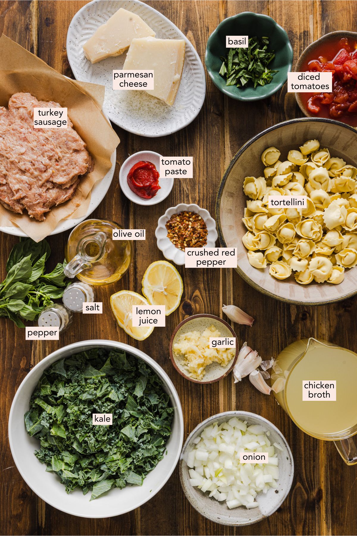 Ingredients to make tortellini kale soup in small individual bowls