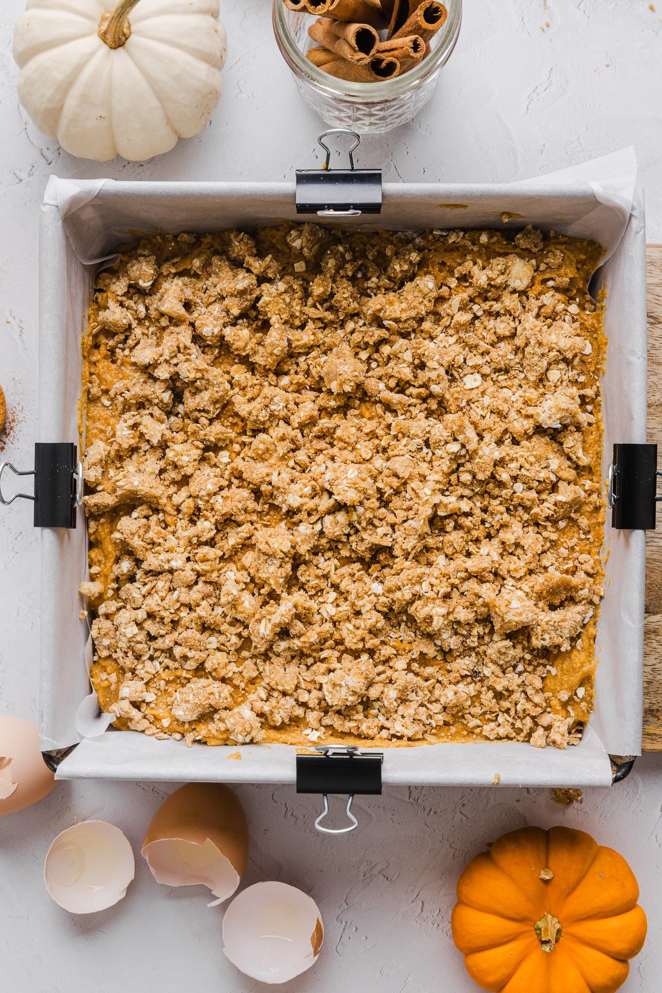 Healthy pumpkin coffee cake batter topped with streusel topping.