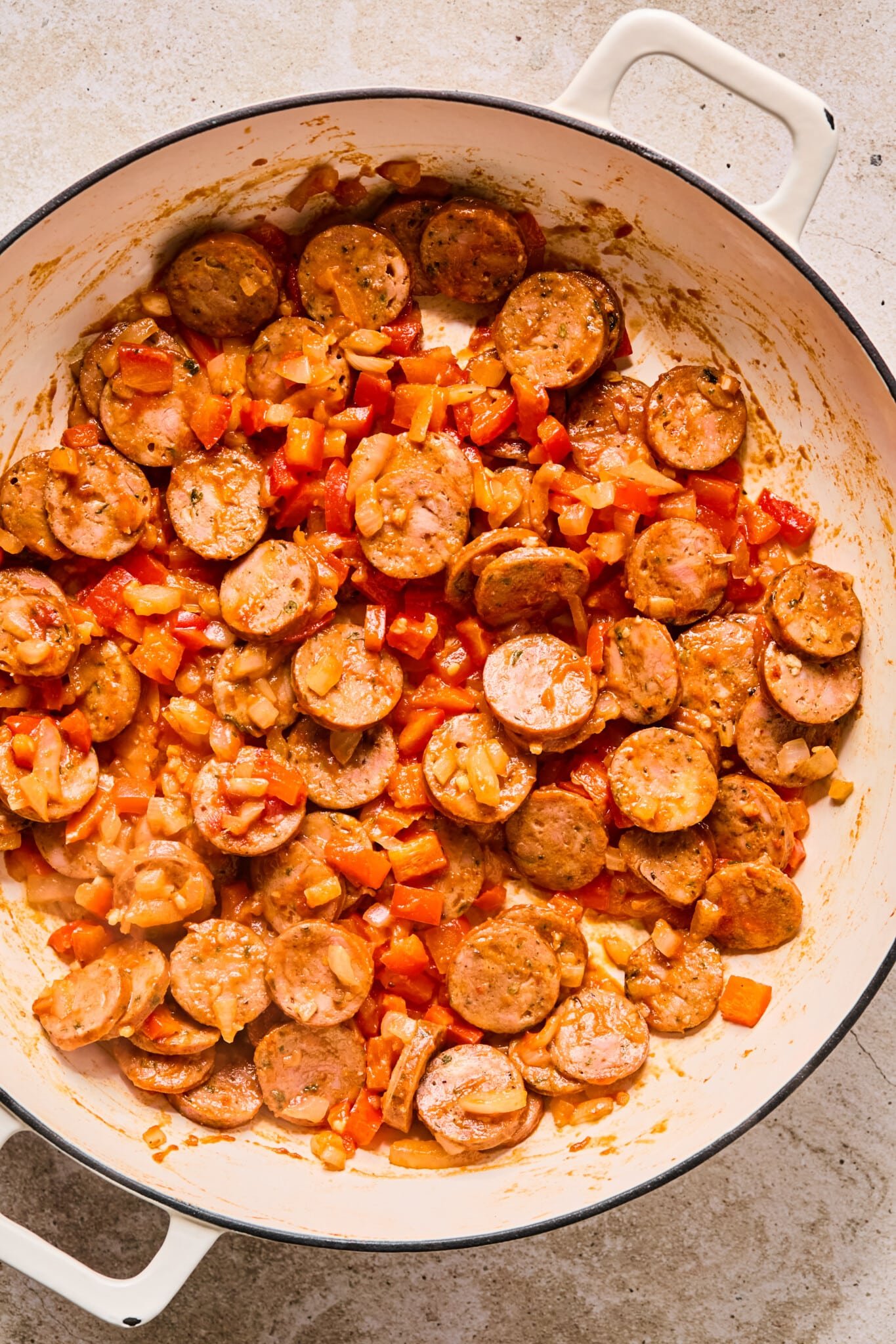 Tomato paste added to chicken sausage and sautéed veggies.