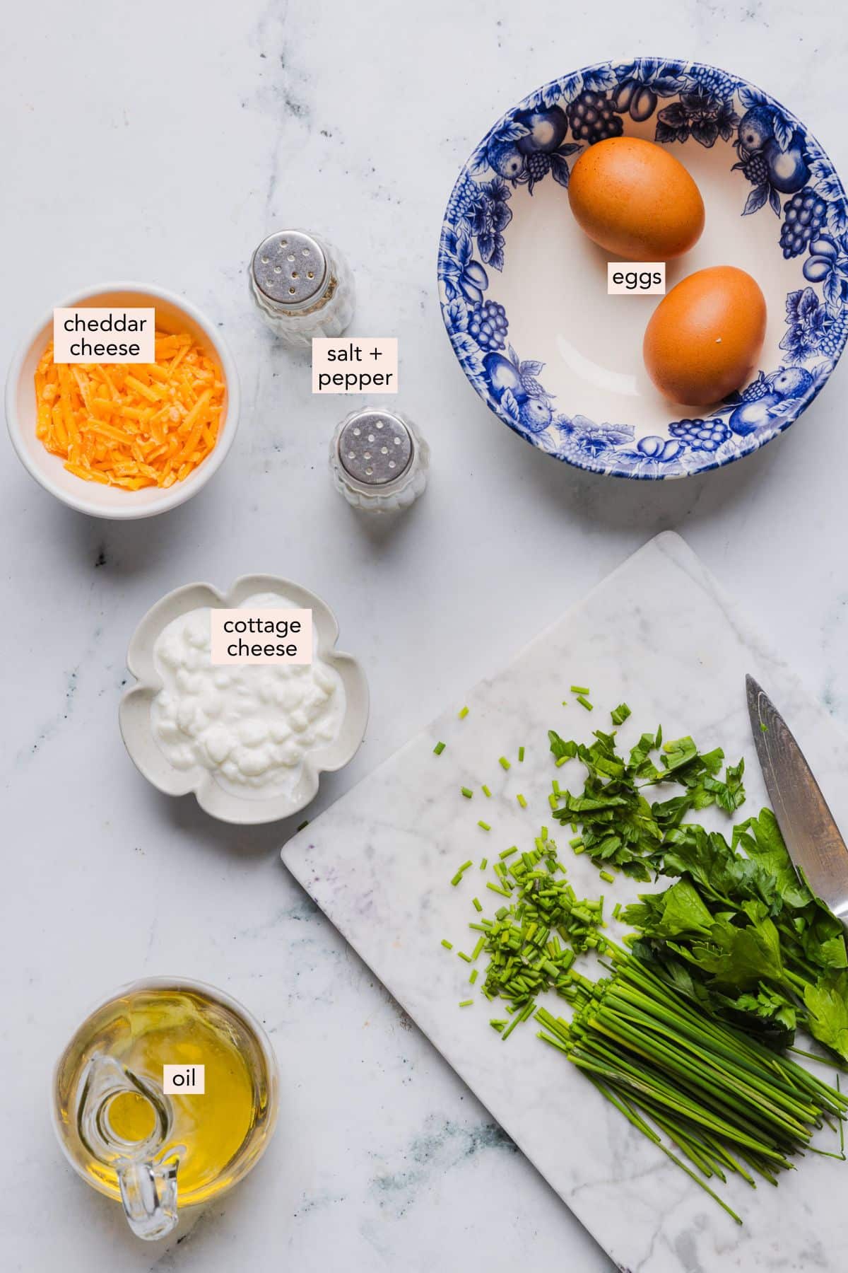 Ingredients for a cottage cheese omelette on a countertop with labels.