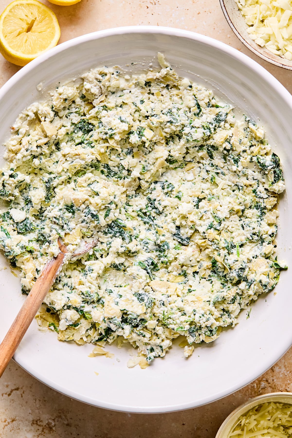 Spinach artichoke dip mixed in a bowl.