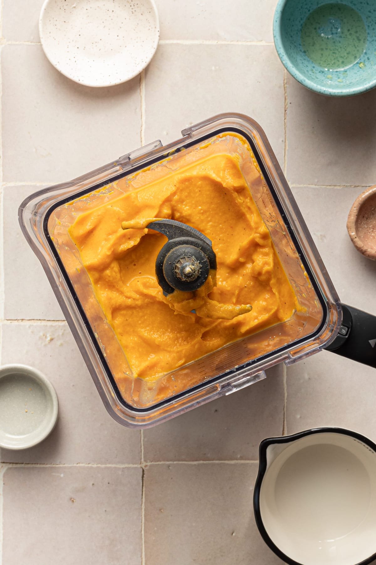 Blended veggies in a blender for hidden veggie Mac and cheese.