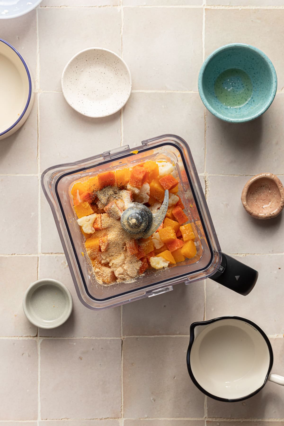 Veggies and milk in a blender for hidden veggie Mac and cheese.