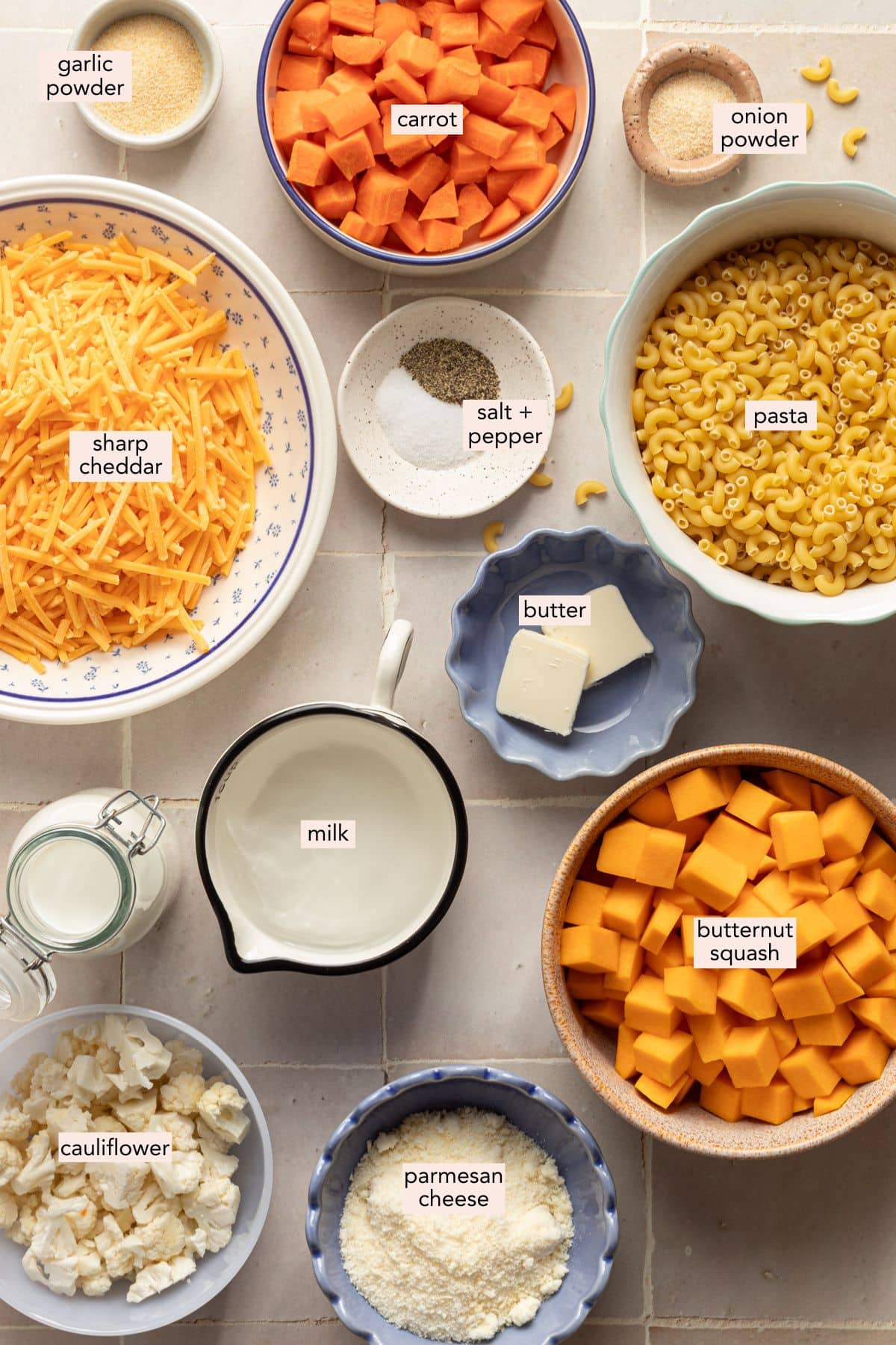 Ingredients for hidden veggie Mac and cheese on a countertop with labels.