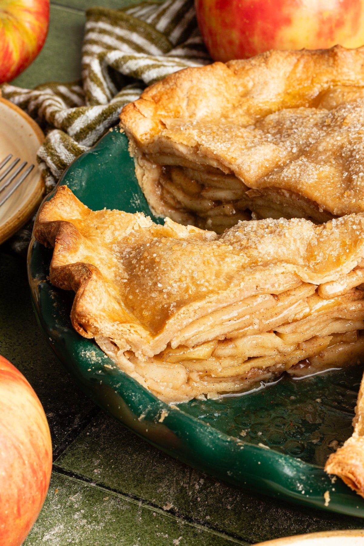 Healthy apple pie sliced in a pie dish.
