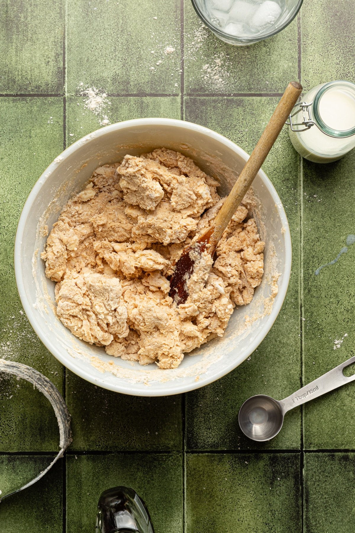 Dough being mixed for apple pie in a bowl.