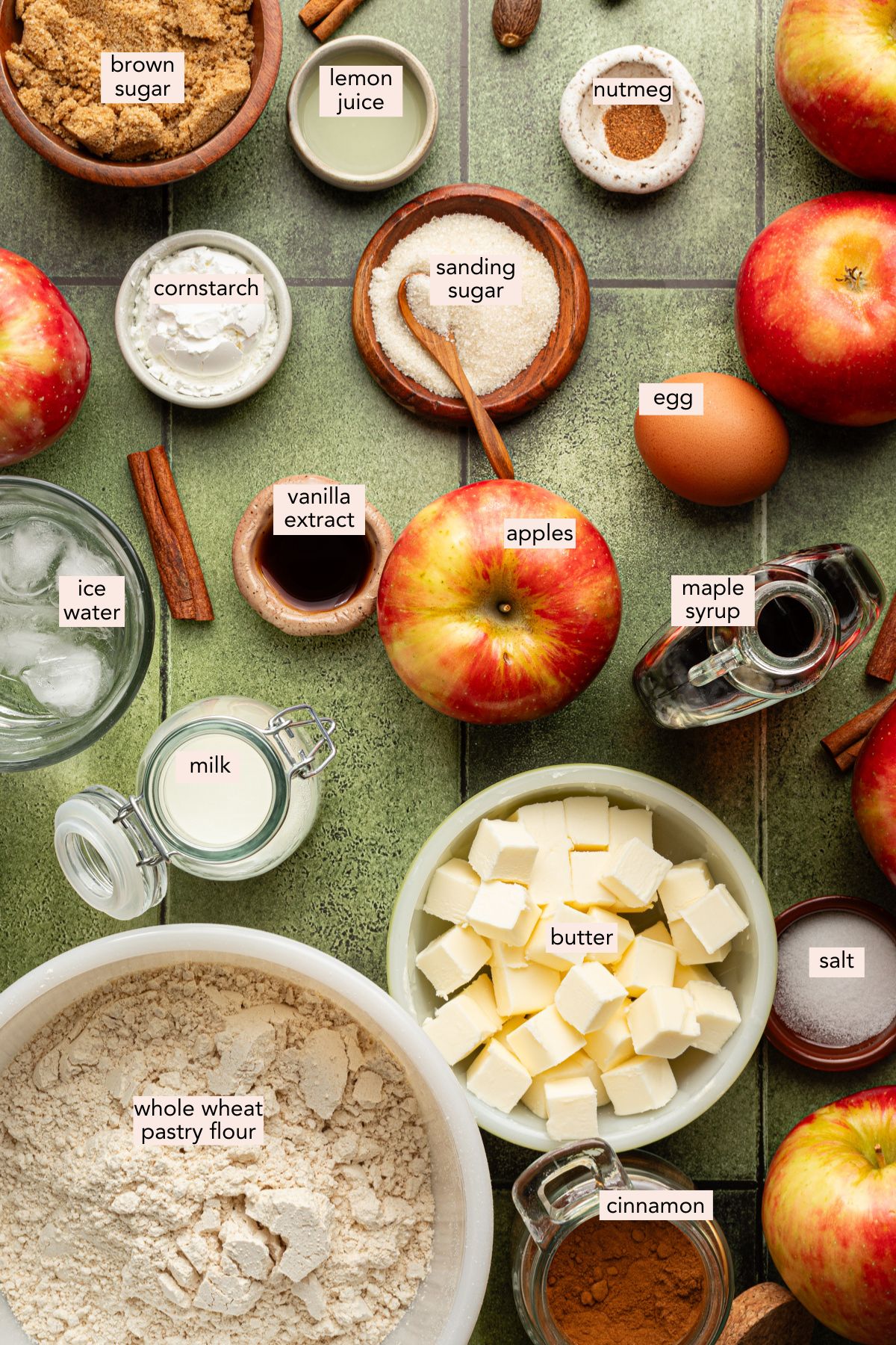 Healthy apple pie ingredients on a countertop with labels.